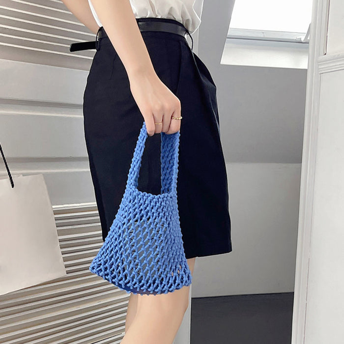 Model carrying a blue Small Multi-Colored Crochet Handbag , easy for commuting and weekends.