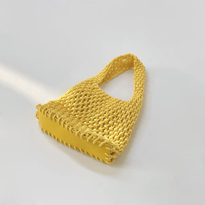 Angled view of Small Multi-Colored Crochet Handbag in yellow, ideal for errands and gifting.