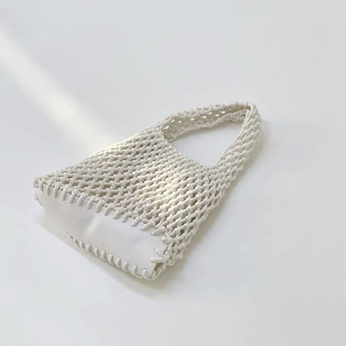Angled view of Small Multi-Colored Crochet Handbag in white, great for everyday carry and travel.