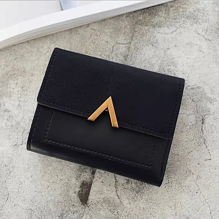 Close-up of Small Wallet With Nubuck Leather Flap in black, easy for organizing cards and cash.