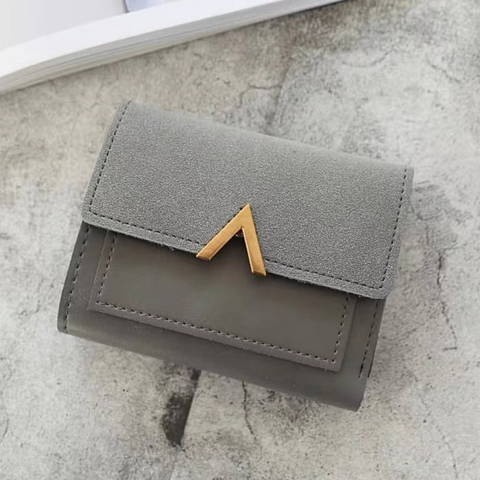 Angled view of Small Wallet With Nubuck Leather Flap in gray, easy for organizing cards and cash.