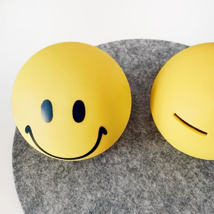 Close-up of Smiley Piggy Bank Ornament product in yellow.