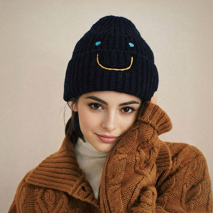 Model wearing Smiley Ribbed Knit Beanie in black. Premium ribbed fabric providing a snug and cozy fit.
