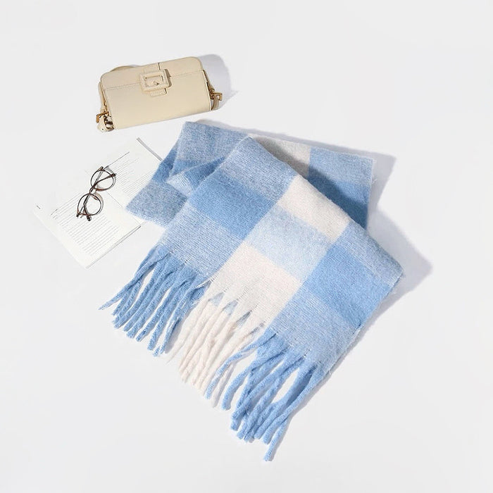 Flat lay of Soft cloud gradient plaid scarf in blue and white, made of polyester-acrylic blend with fringe.