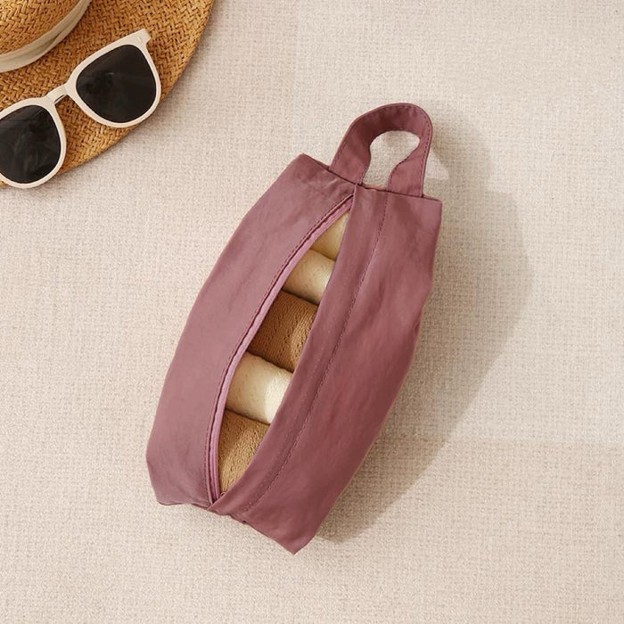 Mauve Soft Hue organizer bag half-open with rolled items inside; zip-top travel pouch for suitcase organization.