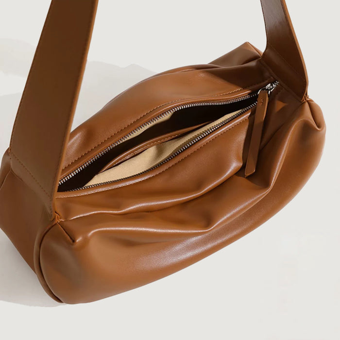 Interior view of  tan Soft Leather Baguette Bag, great for everyday carry and travel.