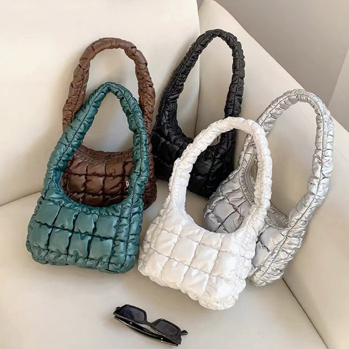 Front view of Five PU leather puffer shoulder bags in brown, teal, black, white, and silver shoulder bag.