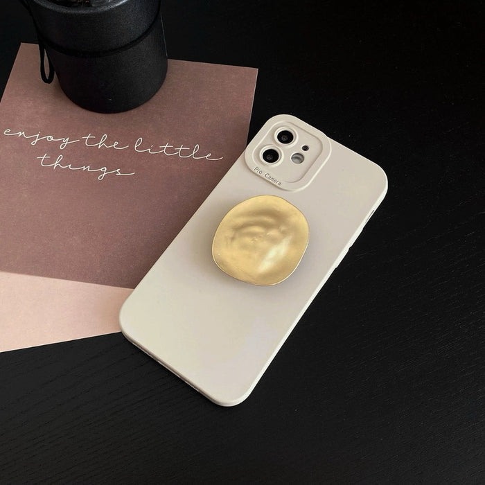 Front view of cream beige phone case. Clean utilitarian aesthetic with a functional metallic stand.