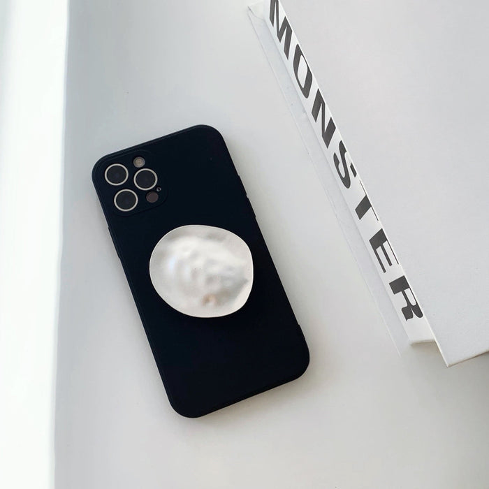 Front view of  black Solid Color Case. Polished minimalist design featuring a versatile built-in kickstand.