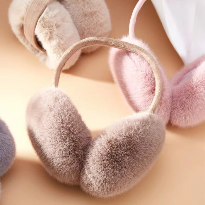 Three plush winter earmuffs in soft faux fur; trendy winter accessories for Apres ski style.