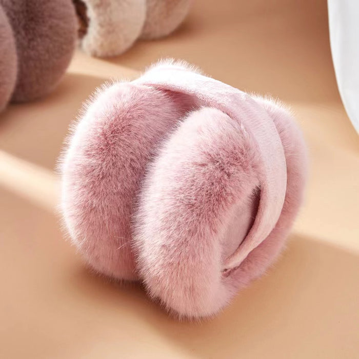 Front view of  pink plush earmuffs; soft winter ear warmers with premium thermal guard.
