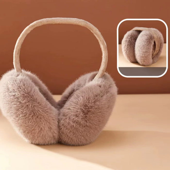 Angled view of nude pink faux fur earmuffs; showcasing the high-loft cozy aesthetic.