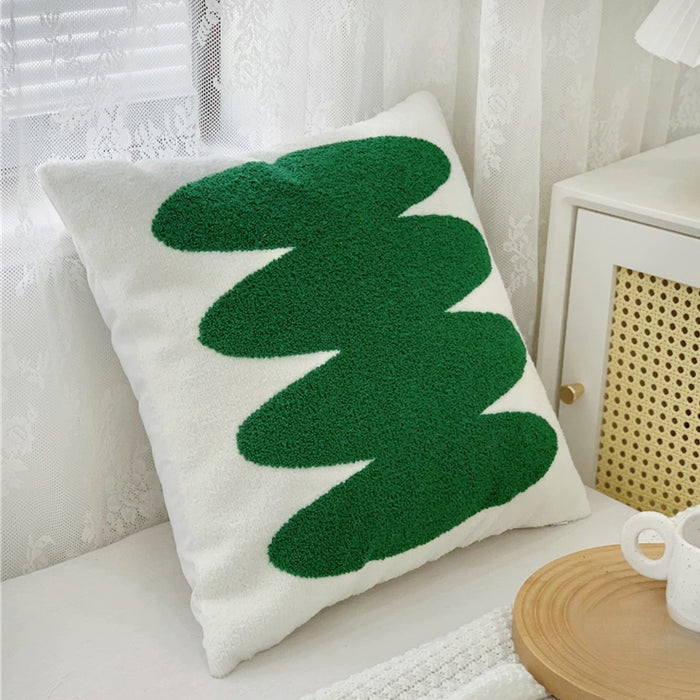 Side view of White cotton Spring Vibe pillow cover with a vibrant green abstract tufted design.
