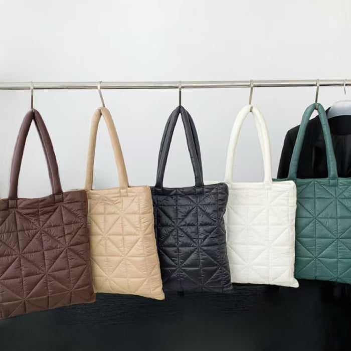 Front view of Five Starburst quilted polyester shoulder bags in brown, beige, black, white, and green polyester.
