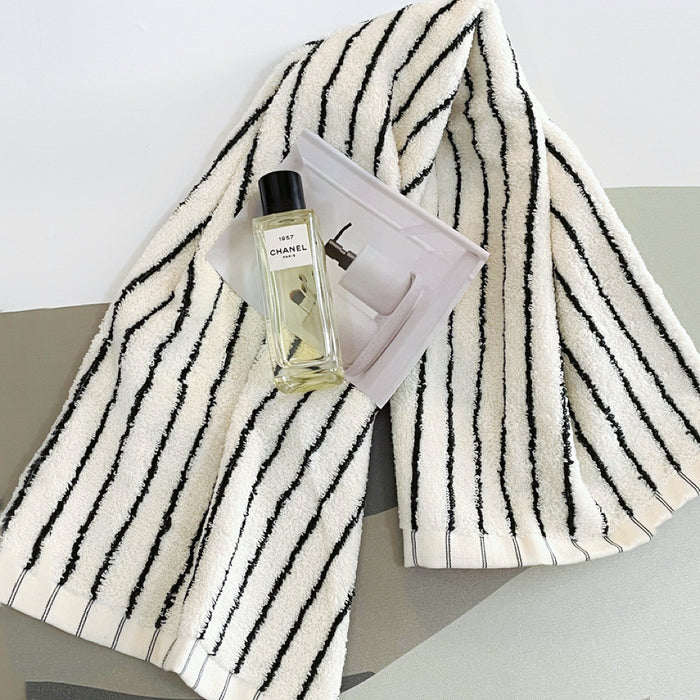 Close-up of Stripe Face Towel , showcasing the cotton fabric and strip pattern.