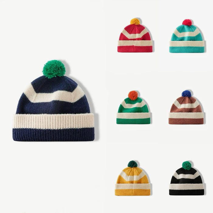 Grid showing seven available color combinations of the striped pompom beanies.