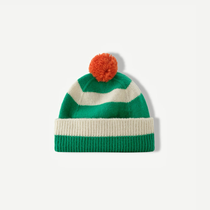 Green and white striped beanie with an orange pompom on a white background.