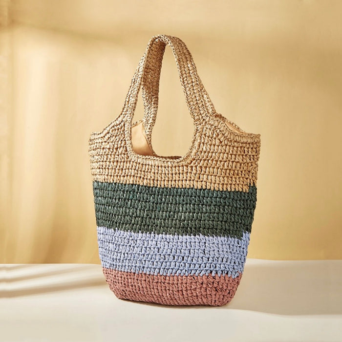 Stripe rattan straw tote bag with natural, green, light blue, and pink horizontal stripes.