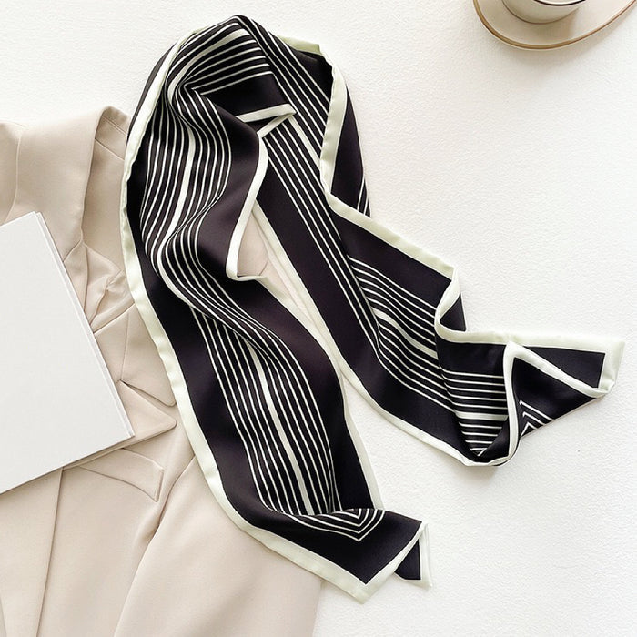 Close-up of Stripe Satin Skinny Scarf in black, ideal for everyday styling and weekend outings.