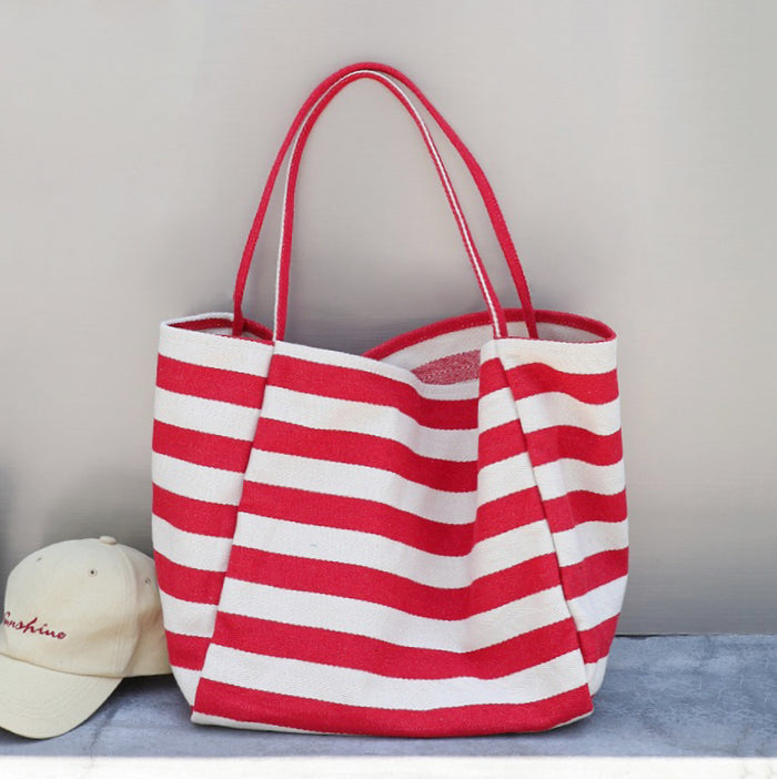 Front view of Stripe Textured Canvas Tote Bag in red, easy for commuting and weekends.