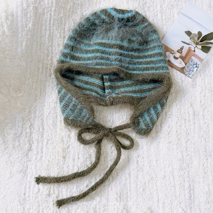 Peacock green and olive green striped earflap hat with soft braided ties.