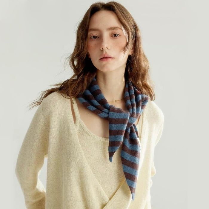 Model wearing the blue and brown striped knit triangle scarf knotted at the front, ideal for daily wear and travel.
