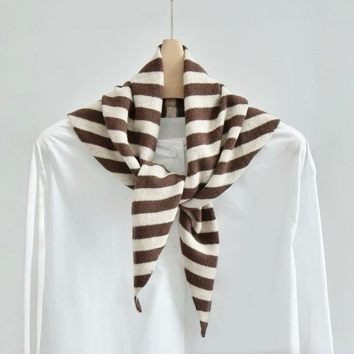 Angled view of the brown and white striped triangle scarf on a hanger, ideal for everyday styling and weekend outings.