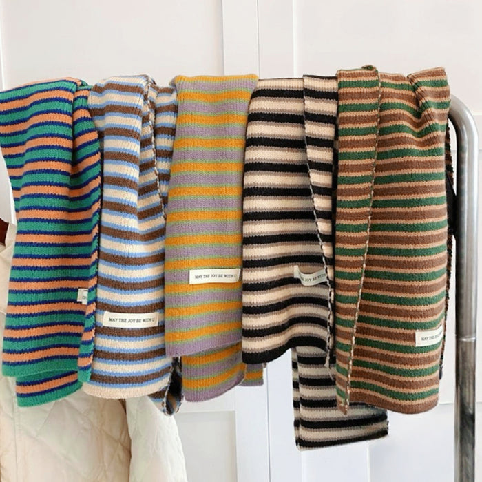Five striped knitted acrylic-cotton scarves in various color combinations on a rack.
