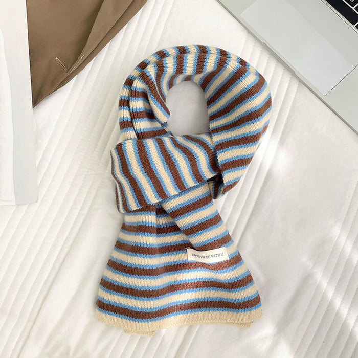 Flat lay of Striped Knitted Scarf in white and brown, great for office layering and commuting.