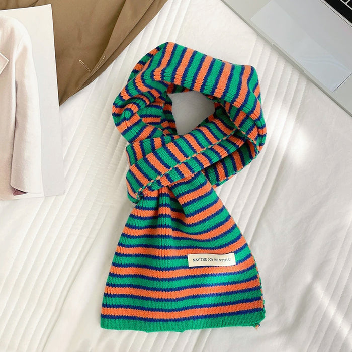 Angled view of Striped Knitted Scarf in green and orange, great for office layering and commuting.