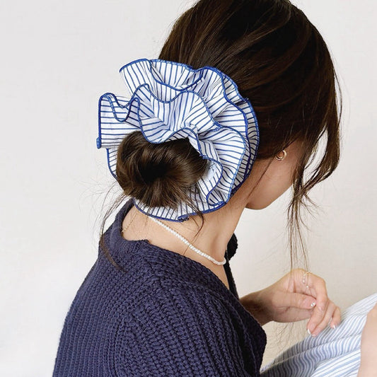 Model wearing a  Striped Layered Scrunchie in blue and white, ideal for everyday outfits and office looks.