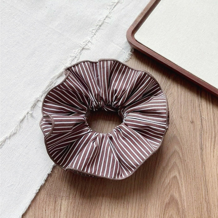 Flat lay of Striped Layered Scrunchie in brown and white, great for everyday styling and gifting.