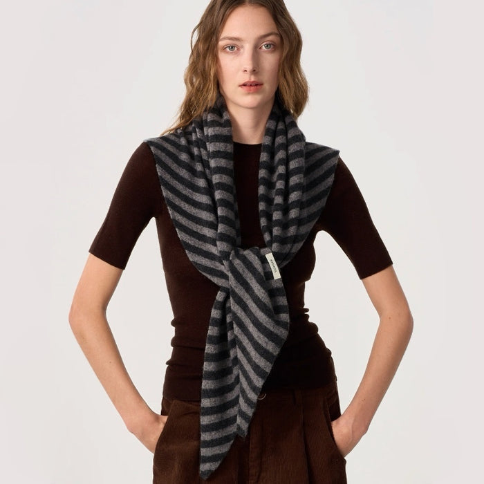 Model wearing the grey and black striped scarf for a minimalist look, ideal for daily wear.