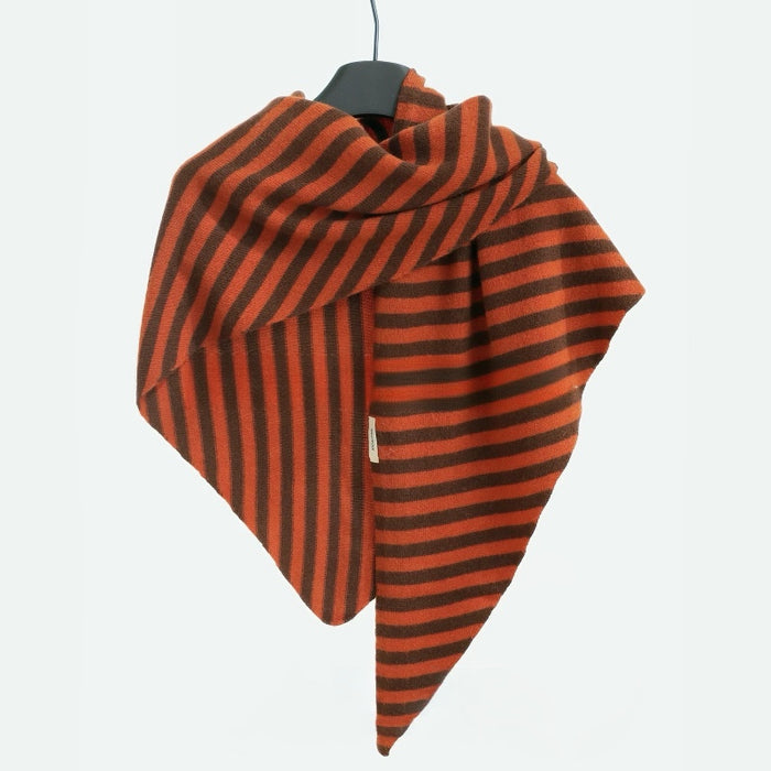Angled view of Orange and brown striped wool scarf hanging on a clean background, easy for travel packing.