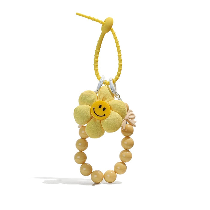 Close-up of Sunny Bloom Bag Charm in yellow, ideal for travel and daily use.