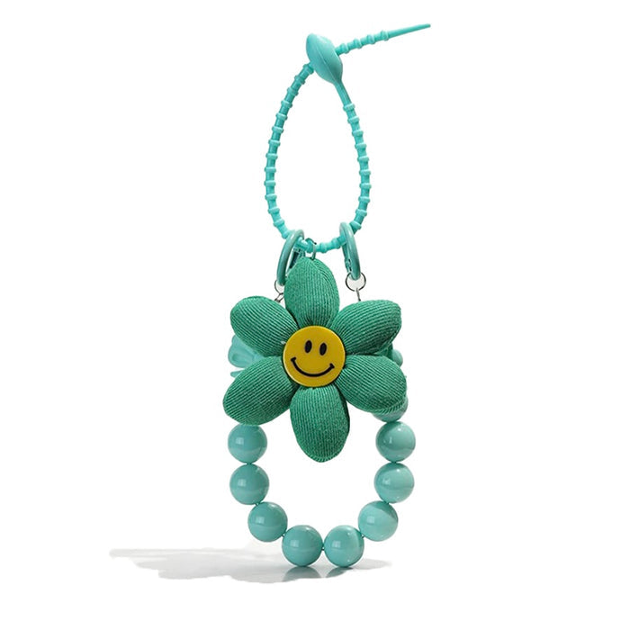 Flat lay of Sunny Bloom Bag Charm in green, great for everyday styling and gifting.