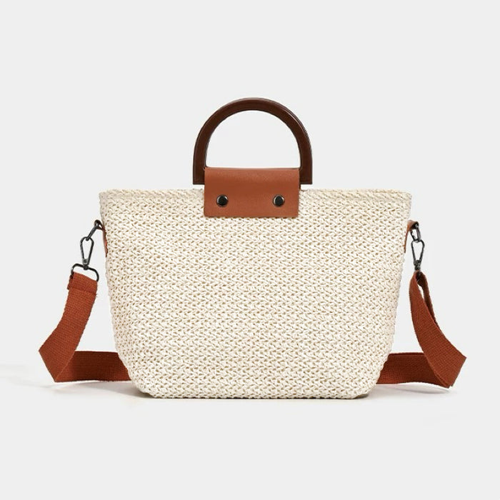 Flat lay of Sunny Straw Woven Bag in white, great for everyday carry and travel.