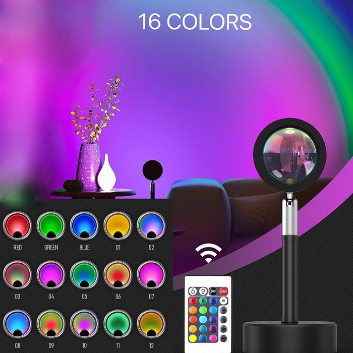 Black iron base lamp projecting a vibrant 16-color sunset/daybreak glow, with color options and remote control shown.