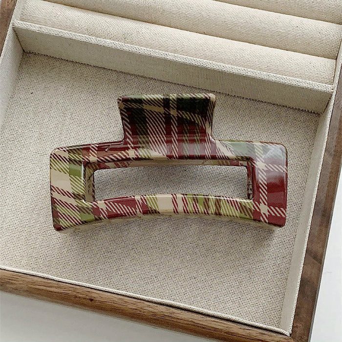 Flat lay of  square Tartan Elegance Hair Claw, great for everyday styling and gifting.