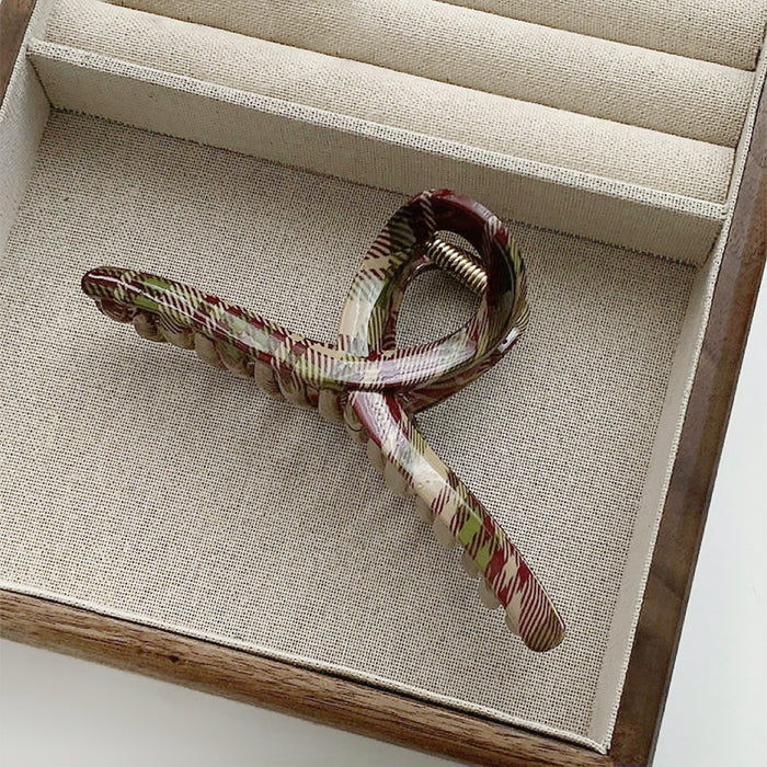 Folded view of one-word style of Tartan Elegance Hair Claw, ideal for quick updos and ponytails.