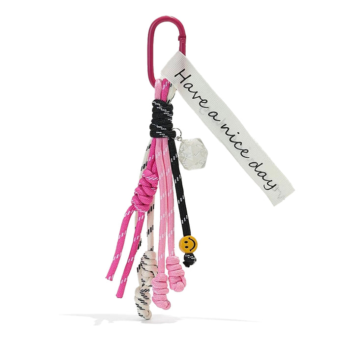 Front view of Tassel Strings Bag Charm in pink, ideal for travel and daily use.