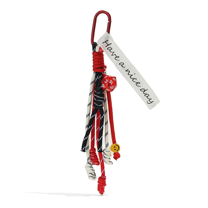 Angled view of Tassel Strings Bag Charm in red, great for everyday styling and gifting.