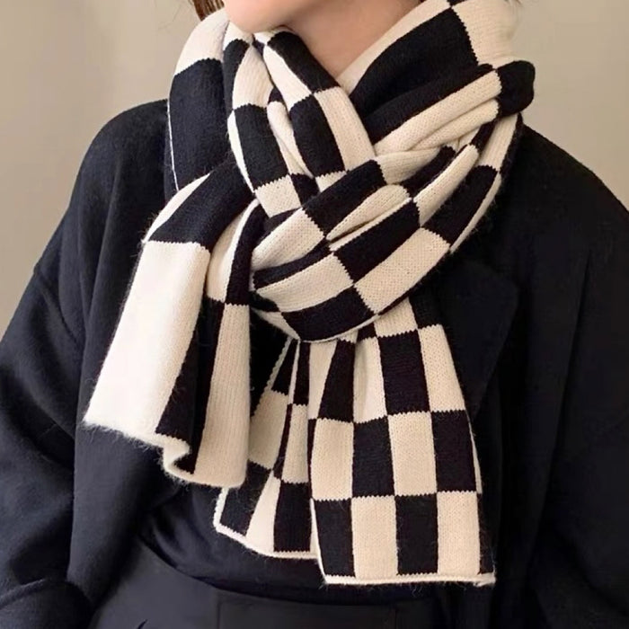 Model wearing a plaid wool scarf in gray, ideal for daily wear and travel.