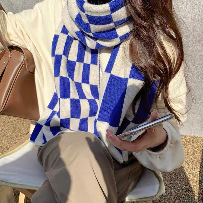 Model wearing a plaid wool scarf , easy for weekend styling and gifting.