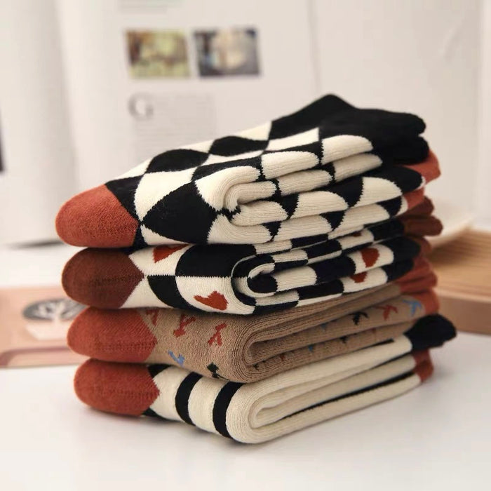 Four pairs of Thick Retro Socks with different patterns stacked together.