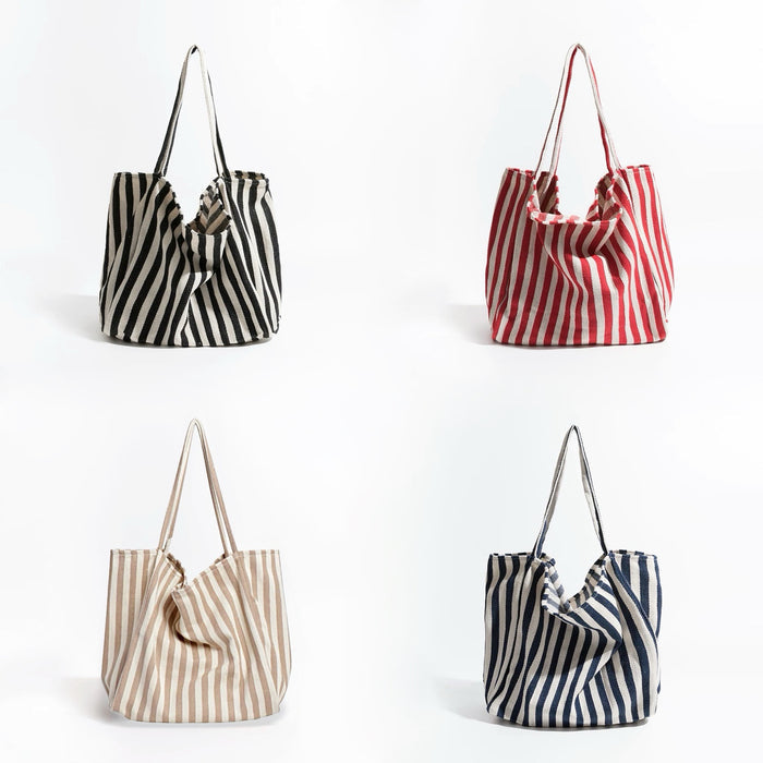 Four thin stripe canvas tote bags: black, red, khaki, and navy blue, all with shoulder straps and open tops.