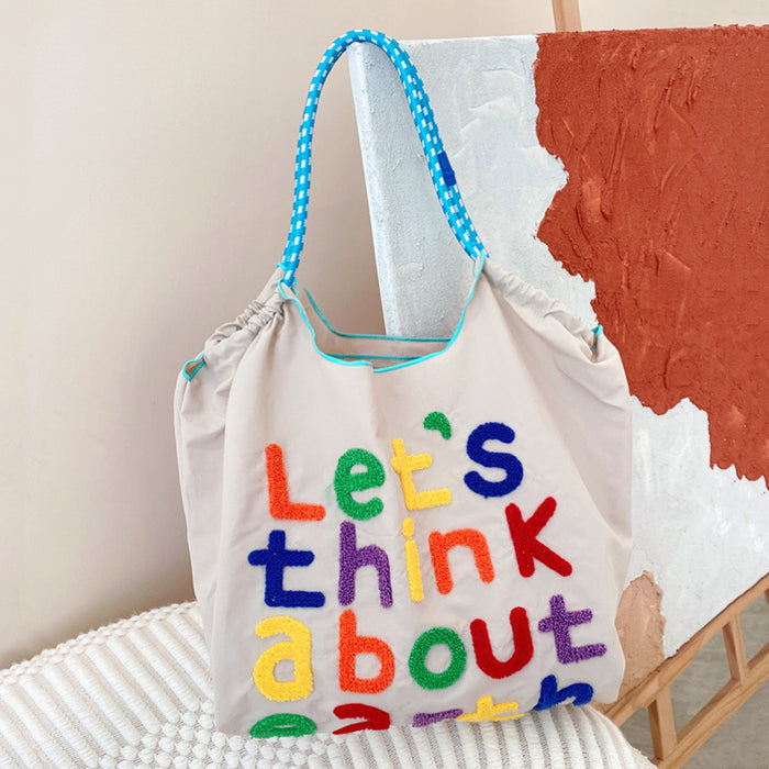 Front view of Think About Earth Tote Bag in beige, ideal for errands and gifting.