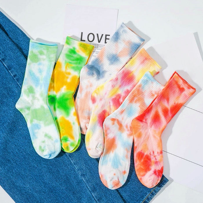 Front view of Six pairs of colorful tie-dye crew socks.