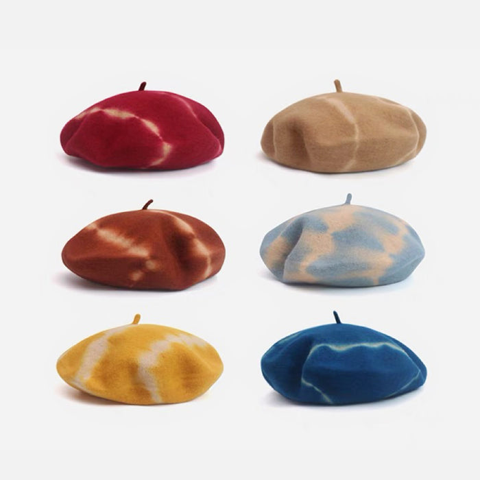 A grid showing six different tie-dye color options for the wool beret.