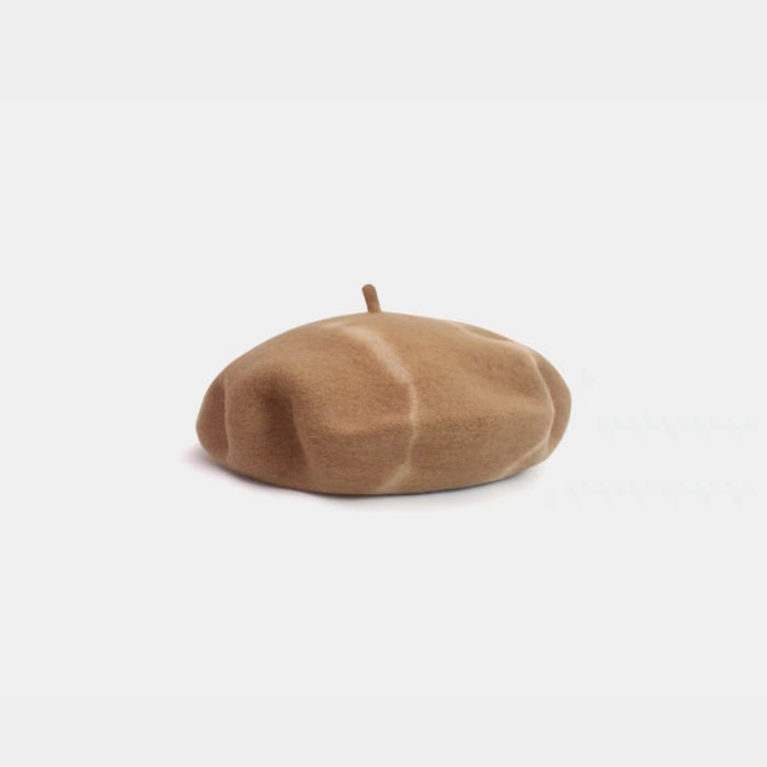 Khaki and beige tie-dye wool beret displayed on a white background.
